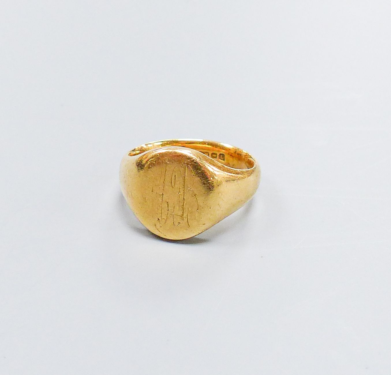 A 1950's 19ct gold signet ring, with engraved inscription, size M, 14.3 grams.